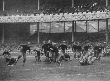 Cornell quarterback Charley Barrett carrying the ball