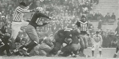 Utah carrying the ball against Utah State in a 1930 football game