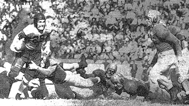 Auburn carrying against Georgia in their 1942 football game