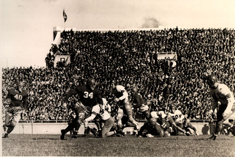 Wisconsin back Crazy Legs Hirsch carrying against Ohio State in a 1942 football game