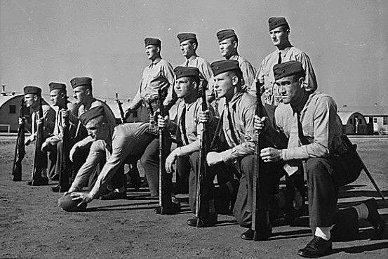 11 former college football player Marines at boot camp in 1943
