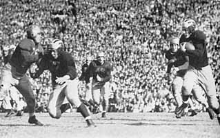 1943 Michigan - Notre Dame football game, Elroy Hirsch carrying for Michigan