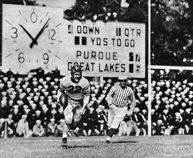 Purdue returning the ball in a 1943 game against Great Lakes Navy