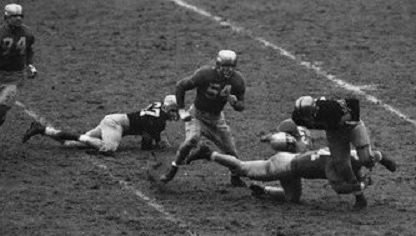 Notre Dame tackling Army ball carrier in 1946
