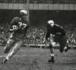 Notre Dame halfback Terry Brennan carrying the ball against Army in 1946
