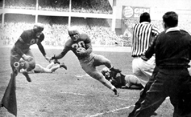 Notre Dame's Bill Gompers about to be stopped short on a 4th down run near the goal line in the 1946 game against Army