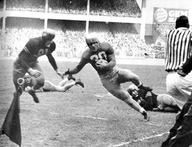 Notre Dame's Bill Gompers about to be stopped short on a 4th down run near the goal line in the 1946 game against Army