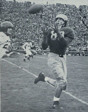 Michigan end Dick Rifenburg catching a pass against Indiana in 1947