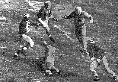 Michigan halfback Bob Chappuis carrying the ball against Minnesota in 1947