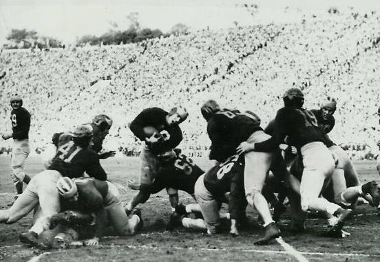 Michigan fullback Jack Weisenbuger scoring a touchdown against Southern Cal in the 1948 Rose Bowl