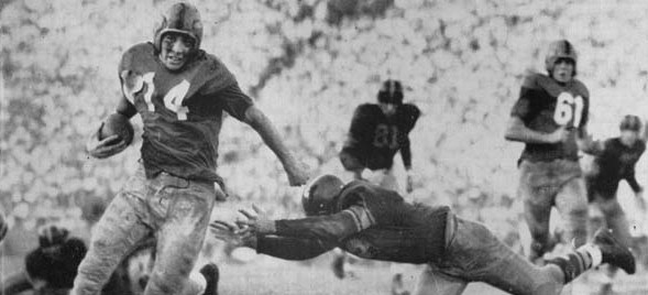 Notre Dame halfback Johnny Lattner carrying the ball in a 1953 game at Southern Cal