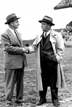Coaches John Cherberg and Red Sanders shake hands after 1954 Washington-UCLA football game