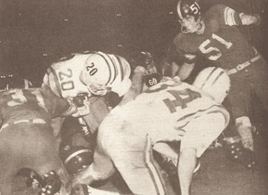 Halfback Billy Cannon carrying the ball for LSU against Rice in 1958