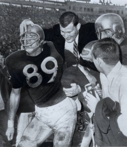 Washington players carry coach Jim Owens off the field after the 1961 Rose Bowl
