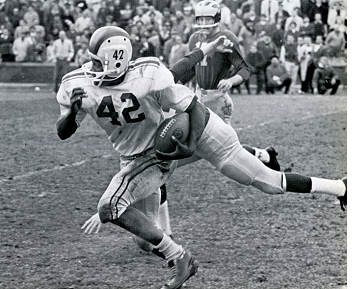 Ohio State halfback Paul Warfield carrying the ball against Michigan in 1961